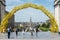 Brussels Old Town - Belgium - Tourists walking through the yellow arcades of the Le Grand depart yellow arcade of the Tour de