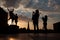 Brussels - Silhouette of jumped boys over the town on Monts des Arts in evening.