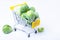 Brussels sprouts in a miniature grocery cart.