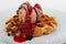 Brussels waffle with creme brulee ice cream  chocolate and cranberry sauce