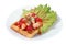 Brussels waffle on plate with lettuce leaf, paprika and fish.