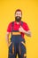 brutal bearded man in mechanic service uniform work as skilled plumber, delivery
