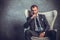 Brutal businessmen in suit with tie sitting on chair