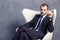 Brutal businessmen in suit with tie sitting on chair