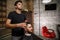 A brutal-looking Barber cuts the hair of an Indian guy. cinematic image