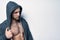 Brutal naked muscular man dressed in a grey hoodie