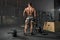 Brutal strong athletic men bodybuilder trains in the gym