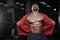 Brutal strong bodybuilder athletic men pumping up muscles with d