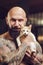 Brutal tattooed man with cat