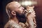Brutal tattooed man with cat