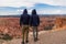 Bryce Canyon - Rear view of loving couple in hoodies with aerial view of massive hoodoos in Bryce Canyon National Park, Utah, USA