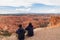 Bryce Canyon - Rear view of loving couple in hoodies with aerial view of massive hoodoos in Bryce Canyon National Park, Utah, USA