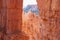 Bryce Canyon - Scenic view through window of narrow massive steep hoodoo sandstone rock formation towers on natural amphitheatre