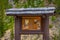 BRYCE CANYON, UTAH, JUNE, 07, 2018: Informative sign in wooden structure in Yellowstone`s Grand Loop surrounded by steep