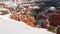 Bryce Canyon in winter, snow in Utah, USA. Hoodoos in amphitheater, eroded relief, panoramic vista point. Unique orange