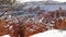 Bryce Canyon in winter, snow in Utah, USA. Hoodoos in amphitheater, eroded relief, panoramic vista point. Unique orange