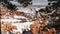 Bryce Canyon in winter, snow in Utah, USA. Hoodoos in amphitheater, eroded relief, panoramic vista point. Unique orange