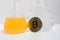 BTC bitcoin coin surrounded by chemicals and lab glassware. Science of crypto currency.