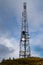 BTS Base transceiver station  with antenna isolated on blue sky background. Telecommunications radio tower cells