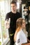 BTS Celebrity hairstylist Marios Atzemoglou in a salon with a female model