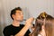BTS Celebrity hairstylist Marios Atzemoglou in a salon with a female model