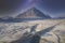 Buachaille Etive Mor at night during winter frost moor with stars in sky highlands landscape and road bridge at Glencoe Scotland