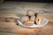 Buah sawo or sapodilla fruit on a white plate