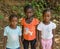 Bubaque, Guinea Bissau - December 09, 2013: Portrait of tthree unidentified young African girls on dirt path