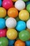 Bubble gum chewing gum texture. Rainbow multicolored gumballs chewing gums as background. Round sugar coated candy
