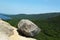 Bubble Rock on top of the South Bubble Mountain and Jordan Pond at Acadia National Park in Maine