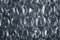 Bubble wrap film close-up, translucent polyethylene shockproof material macro photo background