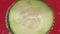 Bubbles and a drop of water on the side of a glass with cucumber slices and ice. To close. Fresh vegetables macro