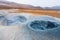 Bubbling geothermal hot/mud pool in the Hverarond area near Myvatn in the Icelandic landscape.