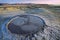 Bubbling mud. Mud volcano at sunset - landmark attraction in Buzau, Romania