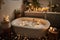 bubbly bath surrounded by candles and other calming scents