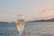 Bubby sparkling champagne flute glass with evening scene while sailing in the Pacific Ocean in Queensland Australia