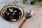 Bubur ketan hitam, Indonesian traditional dessert of black sticky rice porridge with topping  coconut cream