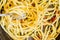 Bucatini pasta with a fork closeup