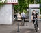 Bucharest/Romania - 05.16.2020: Two girlsl wearing face masks riding bicycles, People enjoying a nice dayin the center of