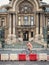 Bucharest/Romania - 10.02.2020: Man riding a bicycle in front of the Palace of the Deposits and Consignments