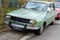 Bucharest, Romania, 19 March 2021 Old retro vivid green Romanian Dacia 1300 classic car parked in a street in a sunny spring day