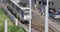 Bucharest, Romania - July 29, 2021: Cars and pedestrians traffic on a busy street of Bucharest with communist era blocks of flats