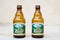 Bucharest, Romania - June 6, 2020: Two brown Ciucas beer bottles, traditional Romanian beer, on dark white background