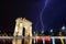 Bucharest Triumph Arch in the light storm by night