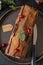 Buche de Noel. Traditional Christmas dessert, Christmas yule log cake with chocolate cream, cranberry. Copy space