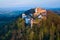 Buchlov Castle. Aerial view on monumental castle in Romanesque Gothic style, standing on a wooded hill.