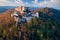 Buchlov Castle. Aerial view on monumental castle in Romanesque Gothic style, standing on a wooded hill.