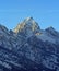 Buck Mountain at sunset with cirrus clouds overhead in the Grand Teton Mountain Range in Grand Tetons National Park in Wyoming