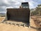 Bucket of crawler bulldozer. Earthmoving heavy machinery on the road construction works