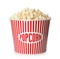 Bucket with fresh tasty popcorn on white. Cinema snack